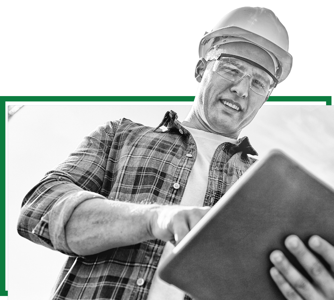 A builder holding a tablet